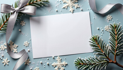 Blank card with silver ribbon, pine branches, and snowflakes on blue background, elegant winter greeting