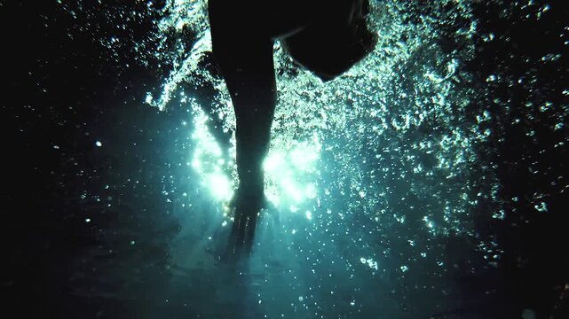 Cinematic Underwater Flip Turn by Professional Male Swimmer in Slow Motion