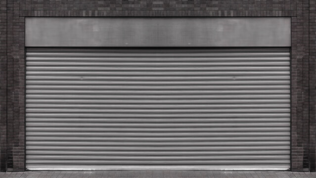 Closed steel shutter door of warehouse, storage or storefront for old dark metal door background and textured.
