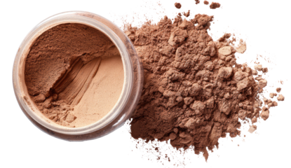A jar of light brown powder makeup, with spilled powder