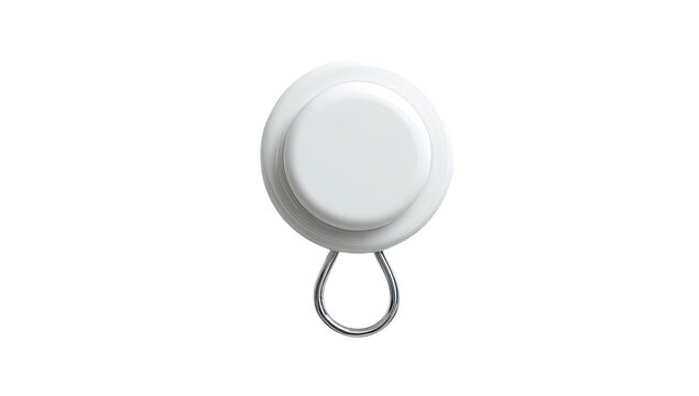 A close-up, top-down view of a white, round object with a metal loop
