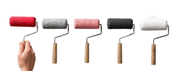 A hand holds a red paint roller, four others with varying colors lay next to it, against a black backdrop