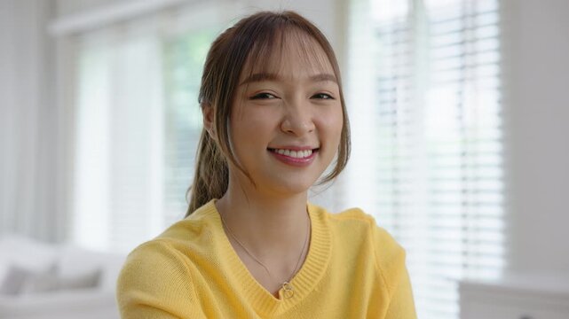 Work from home office desk asia people digital nomad young gen z teen female smile look at camera sit self relax tech talent remote career life balance happy hybrid stock trader job study learn online