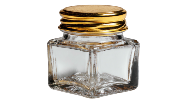 Small, clear, square glass jar with a golden lid, isolated on black background, close-up shot
