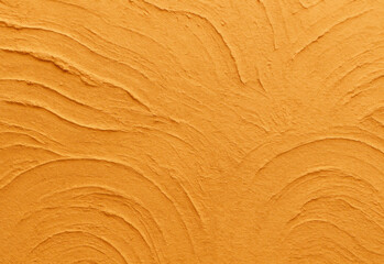 Close up of golden desert sand textures showing wind-sculpted ripples and flowing ridges, revealing intricate dune patterns and warm sunlight on arid terrain, natural beauty