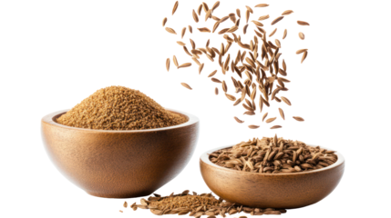 Two wooden bowls filled with cumin seeds and falling cumin seeds isolated on transparent background