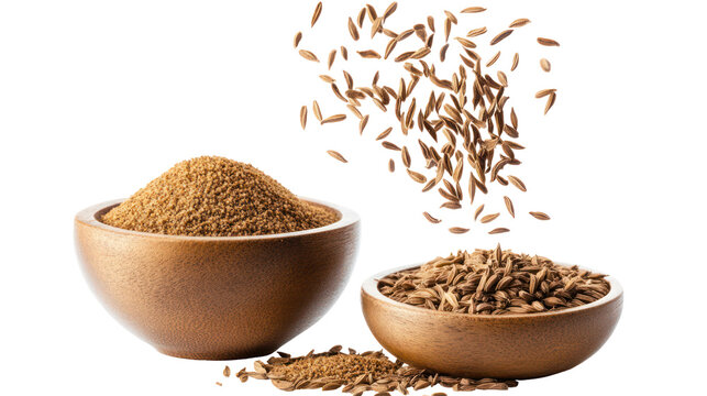 Two wooden bowls filled with cumin seeds and falling cumin seeds isolated on transparent background