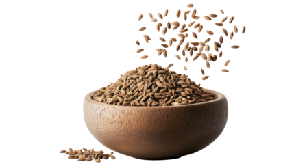 Pile of whole cumin seeds spilling from a wooden bowl isolated on transparent background
