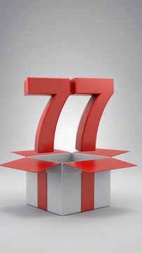 Nicely wrapped gift box popping open, the number 77 appears. Video for birthday or anniversary party