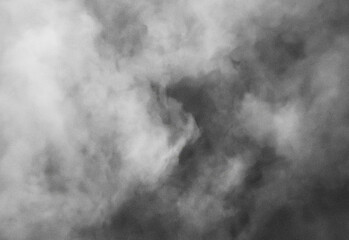 Abstract grayscale smoke texture with swirling fog and gradient tones, atmospheric background for design projects, photography backdrops, video overlays, and creative compositions