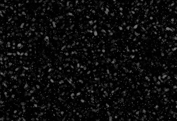 Professional black speckled texture background with random white specks resembling snowfall or starry dust, ideal for design projects, backdrops, and user interface accents