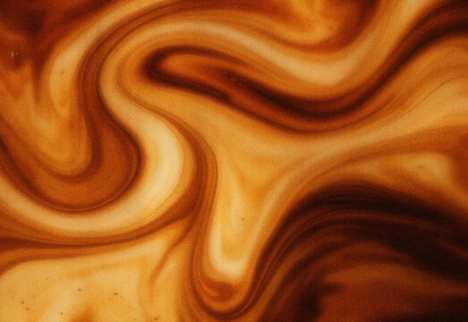 Abstract marbled background with warm caramel and coffee brown swirls, smooth flowing liquid texture resembling wood grain, ideal for graphic design, branding backdrops