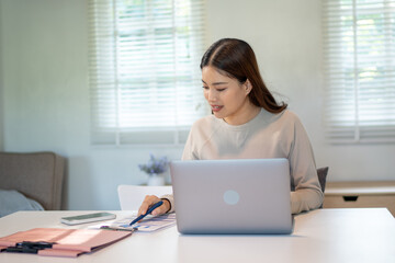 Lovely mom and little young daughter spending time together in their living room.