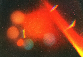 Abstract nighttime photography featuring vivid red neon light streaks, soft bokeh orbs, and subtle rainbow prism flares to create an energetic moody urban atmosphere