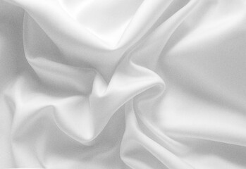 Obraz premium Close-up shot of luxurious white silk fabric with flowing folds and shadows, highlighting silky texture, smooth drape, and premium textile quality for fashion, design background use