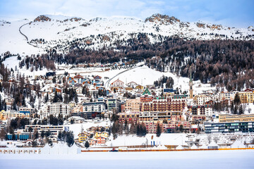 Town of Sankt Moritz luxury winter travel destination view from frozen lake