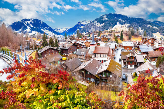 Idyllic Alpine village of Gstaad panoramic rooftops view, luxury winter destination