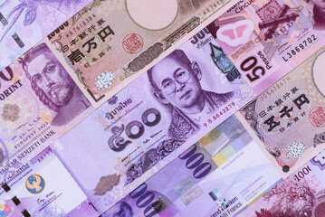 Obraz premium Money background, currency exchange, paper banknotes from different countries. Money cash currency