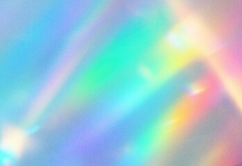 Obraz premium Abstract rainbow gradient with soft grain texture and gentle light flare, showcasing vibrant spectrum hues across a subtle bokeh surface for creative design and art projects