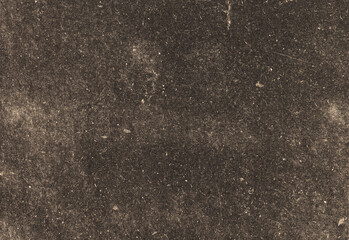 Close up of rich dark soil texture with fine granules and subtle speckling, showing natural earthy surface details ideal for backgrounds design projects, textures and creative use