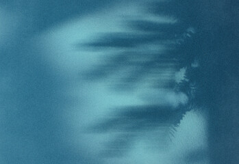 Abstract blue underwater dreamscape with light rays and blurred palm frond silhouettes, creating a tranquil atmospheric background for design, technology, and nature projects