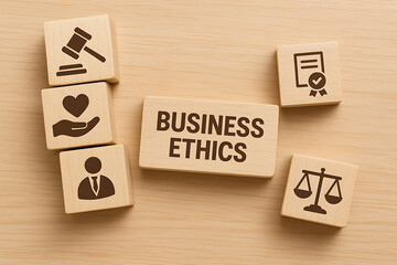 Wooden blocks with business ethics concept showing law justice trust responsibility and corporate morality in organizational governance and professional standards