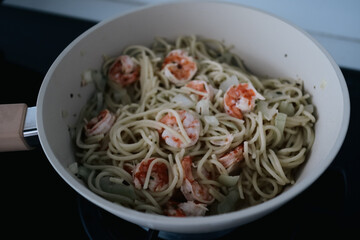 Shrimp and Spinach Pasta in White Pan - A Delicious Meal.