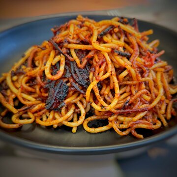 Close-up of a traditional Spaghetti all'Assassina (Assassin's Spaghetti) pasta dish, Bari, Puglia, Italy
