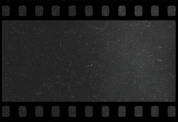 Obraz premium Dark vintage film strip frame with subtle grainy texture and speckled black background, ideal cinematic backdrop for design projects, photography, posters, and compositions