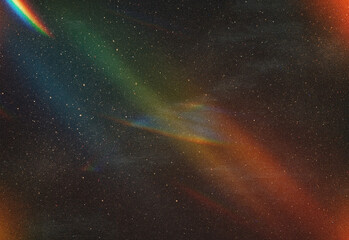 Vibrant aurora borealis across a clear starry night sky with blue and red ribbons illuminating the cosmos, creating a breathtaking celestial display for photography and nature