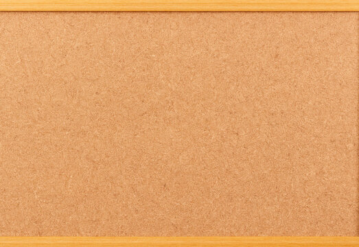 Blank corkboard with light wooden border, an empty bulletin surface ideal for office and home use, perfect for posting notes, reminders, photos, to-do lists, inspiration