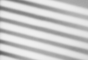 Obraz premium Abstract grayscale image of diagonal light and shadow stripes across a smooth surface, creating a minimalist pattern ideal for background design, modern decor, and creative layouts