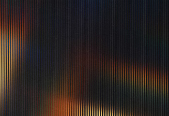 Moody abstract texture with vertical ribbed panels and soft warm orange highlights, creating a cinematic, enigmatic background suitable for design, branding, and creative layouts