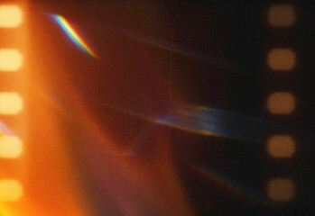 Cinematic abstract light leak texture featuring warm orange glow and cool blue film grain, moody retro background ideal for creative photography and design