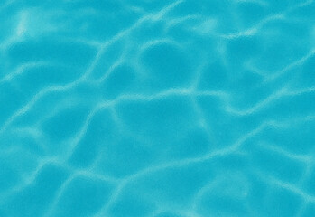 Crystal clear turquoise water surface with a gentle ripple in a tranquil pool, creating a refreshing mood ideal for travel, leisure, summer lifestyle, and outdoor photography