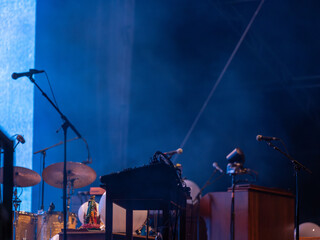 Dimly Lit Stage with Drums and Microphones © UA-Visions.com