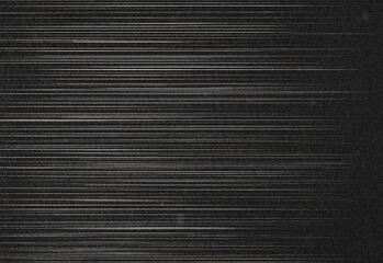 Obraz premium Abstract dark textured background featuring subtle horizontal noise and light streaks reminiscent of old television static, suitable as tech design backdrop or visual overlay