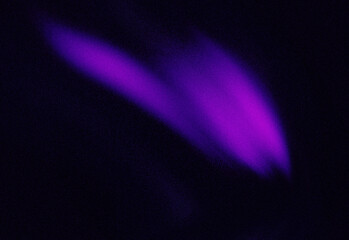 A vivid purple aurora-like arc glides across a clear starry night sky, creating a dramatic, ethereal atmosphere ideal for space exploration, astronomy, travel and nature imagery