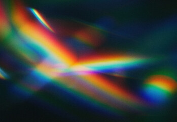 Abstract light spectrum with vibrant rainbow colors and grainy texture, featuring blurred prism reflections and luminous streaks across a dark background for modern design projects