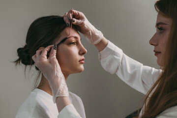 hydrating facial mask on caucasian woman cheeks with gentle massage and soothing clinic atmosphere