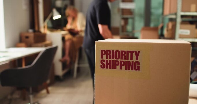 Priority shipping label, box and distribution office for ecommerce, supply chain or logistics. Package sticker, startup and express delivery service with important parcel, team and business people