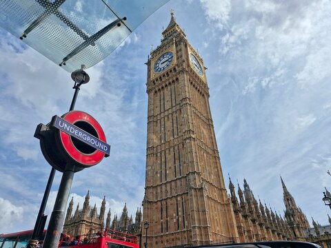 LONDON, UK-JULY 14 2025:Transport for London (TfL) Underground Westminster station with London&rsquo;s Big Ben Clock Tower in the background. The roundel logo is one of the most recognised logo in the world