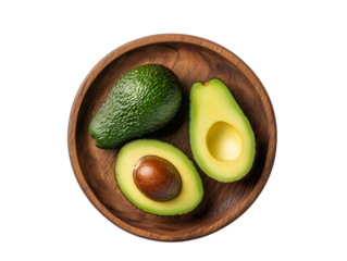 Fresh green avocados cut and whole presented in a wooden bowl for healthy eating and cooking ideas