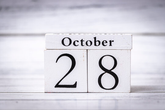 Wooden calendar showing October 28, representing the date with a rustic feel. Ideal for seasonal themes, organization, and time management applications.