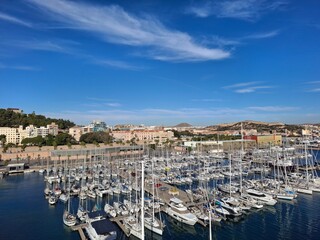 spain marcia jan 4 2024 Marina Full of Sailboats in a Coastal City Harbor Under Bright Blue Sky