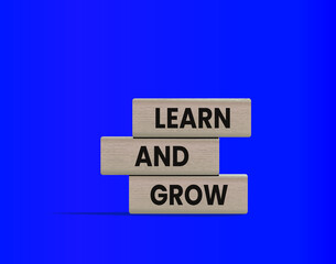 Learn and Grow Concept on Wooden Blocks, ideal for topics related to training, coaching, e-learning, academic studies, and lifelong improvement