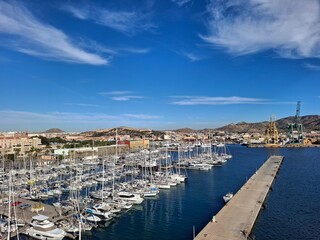 spain marcia jan 4 2024 Marina Full of Sailboats in a Coastal City Harbor Under Bright Blue Sky
