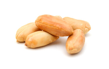 Dried peanuts in closeup on white