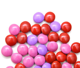 Stack sugar coated pills on white background