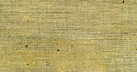A flat texture of yellow linen, with small speckles of paint and fabric textures.